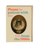 Card with a cat illustration and text 'Please be patient with me, I'm from the 1900s' on a beige background