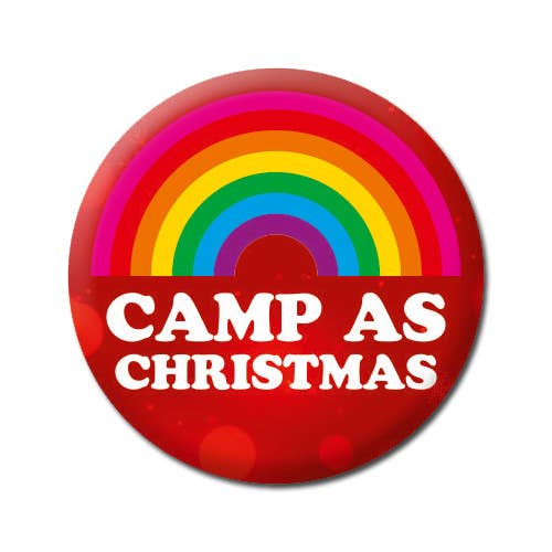 Camp as Christmas Gay Christmas Badge .A red Christmas badge with a half rainbow patter and underneath rounded white text reads Camp and Christmas.