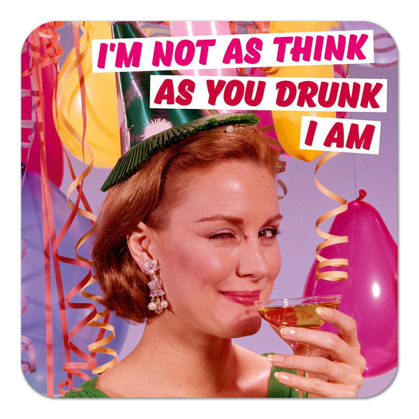 A coaster with a retro-style photo of a woman in front of balloons at a birthday party, wearing a party hat and winking while drinking alcohol. Above her are the words 'I'm not as think as you drunk I am' in capitalised, light and dark pink font against a white banner.