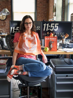 Photo shows a hangry woman in a cafe wearing a pair of hamgry socks