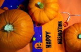 Halloween pumpkin socks set amidst pumpkins